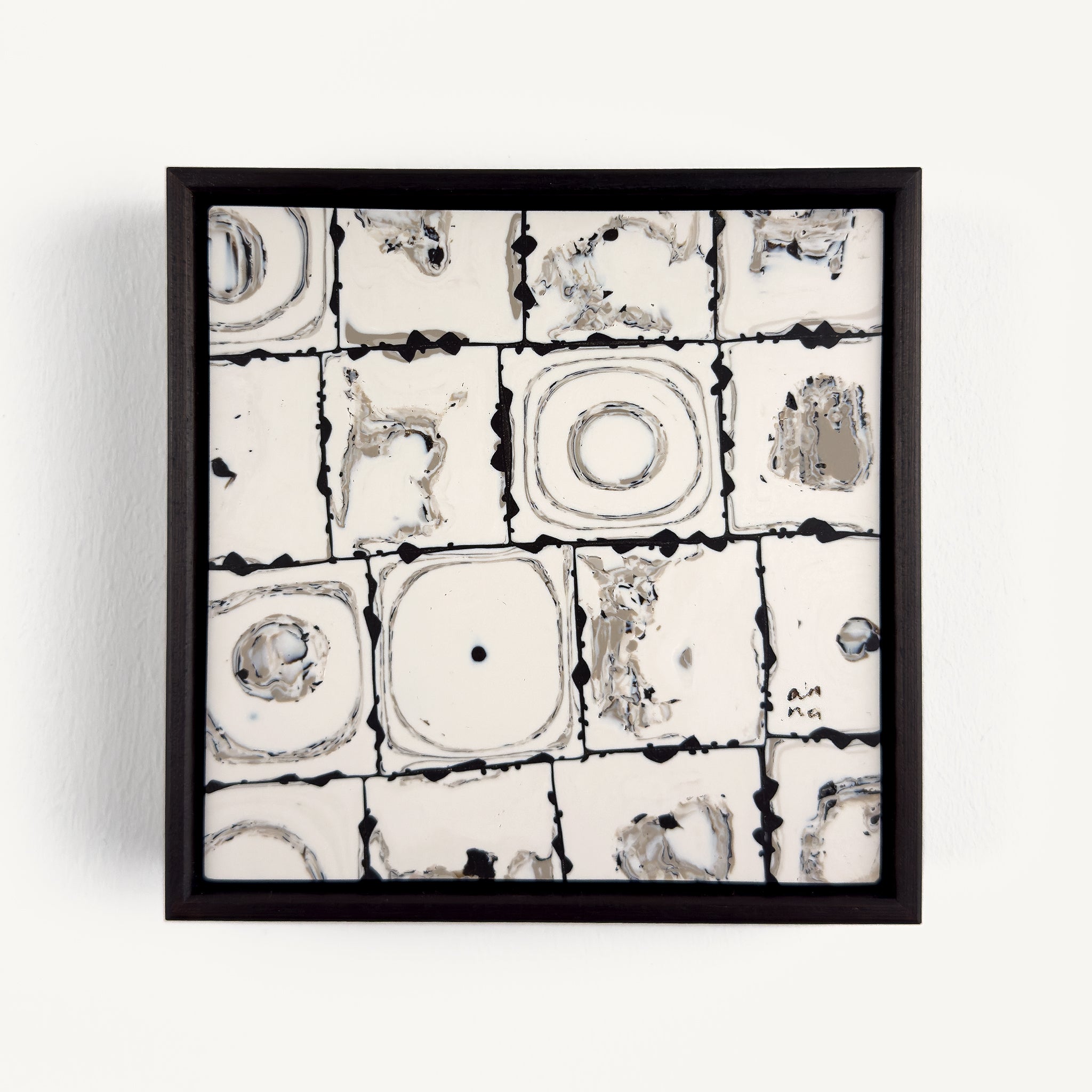 Ēa (Study III), a contemporary abstract polymer clay artwork composed of a grid of off-white toned square tiles featuring organic circular impressions, fragmented textures and subtle grey marbling. Dark brown grout-like lines and irregular edges emphasise the handmade surface, creating a quiet dialogue between order and erosion. Presented in a solid wood veneer tray frame finished in dark English walnut, measuring 17 × 17 cm.