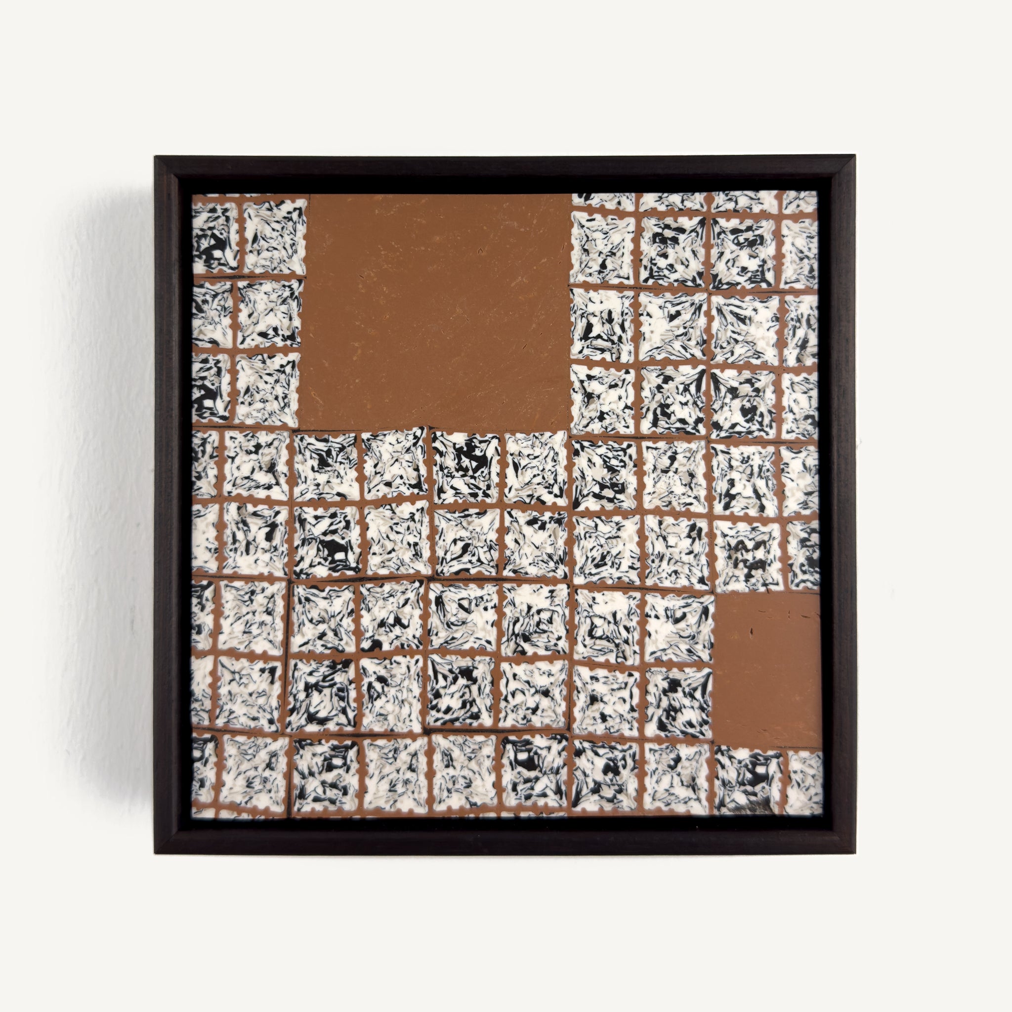 Greót I, by artist Anna Mills, a contemporary abstract polymer clay artwork featuring a grid of individually sliced black, white and beige patterned squares arranged around open terracotta-coloured negative spaces. The composition is presented in a solid wood veneer tray frame finished in dark English walnut, measuring 17 × 17 cm.